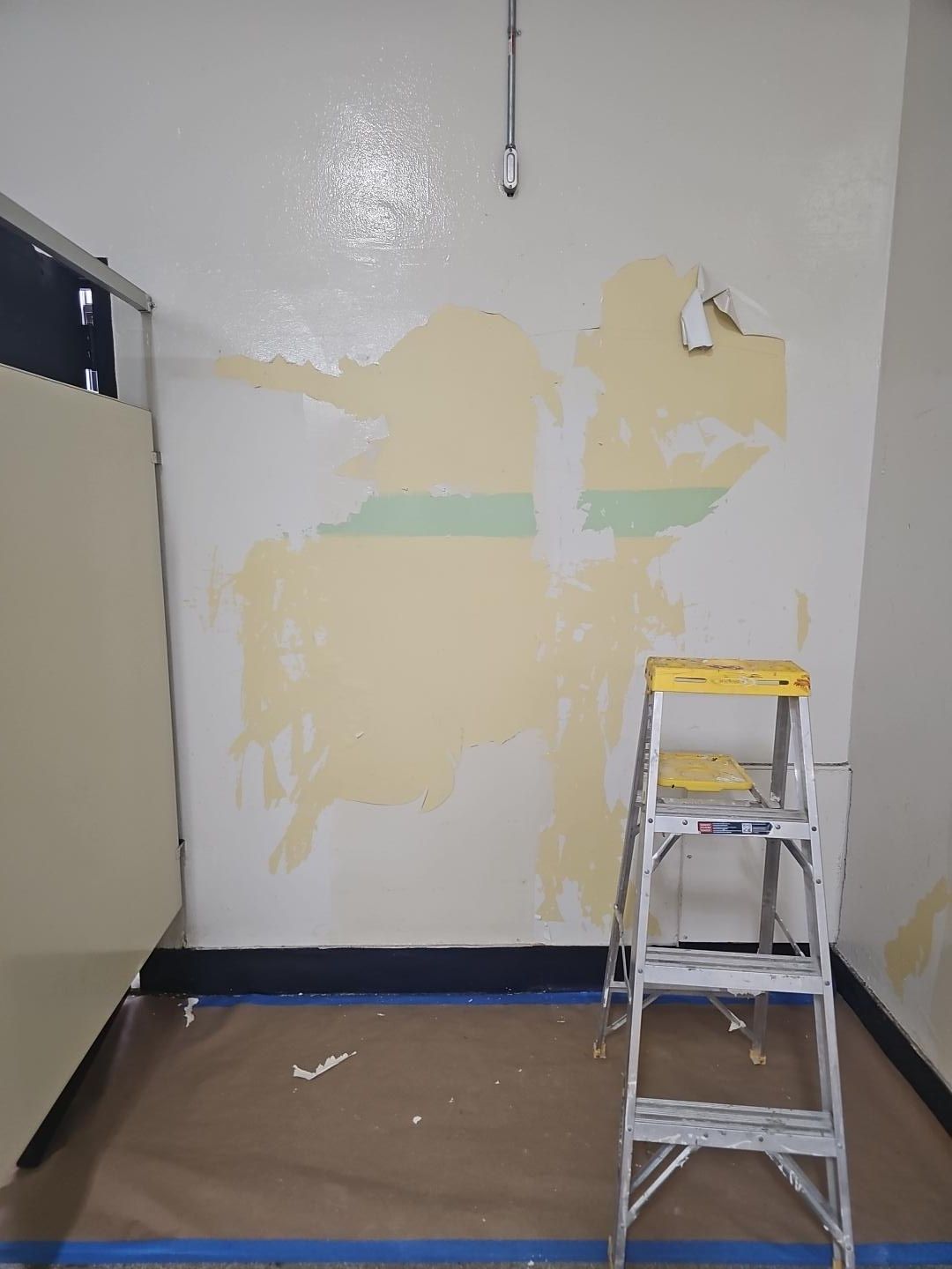 Surface preparation with deteriorated coatings removed.
